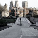 City Of York - Brown Buildings on End of Road Under Cloudy Sky