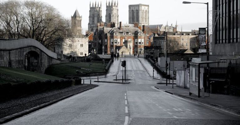 City Of York - Brown Buildings on End of Road Under Cloudy Sky