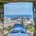 Edinburgh Castle - Selective Focus Photography of Cannon and Buildings