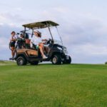 Golf Courses - People Riding a Golf Cart