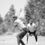 Cricket Match - Man Playing Cricket in Black and White