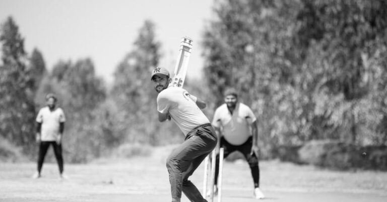 Cricket Match - Man Playing Cricket in Black and White