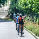 Cycling Tour - Man and Woman Riding Bicycle