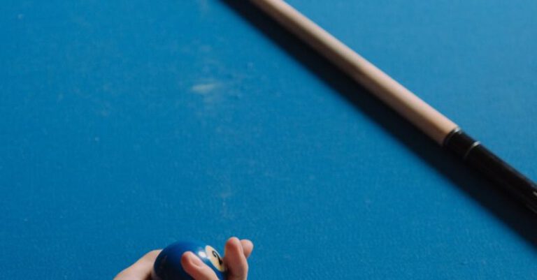 Snooker Halls - Person Holding Brown Wooden Stick