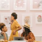 Fashion Designers - People Sitting on Chair in Front of Table