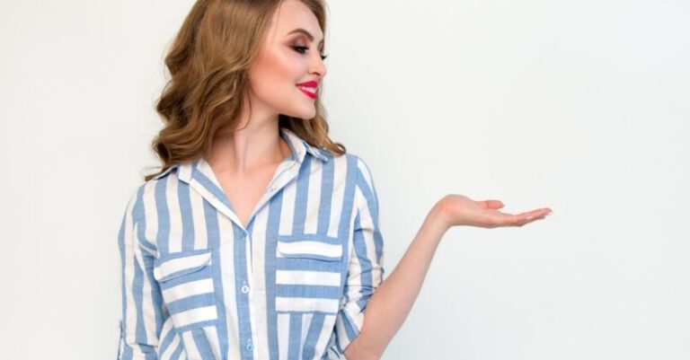 Fashion Shows - Woman in Blue and White Striped Top Raising Her Left Hand