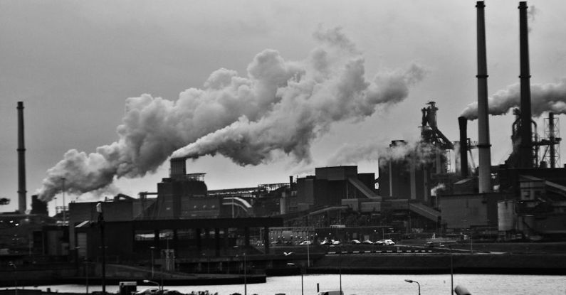 Industrial Revolution - Grayscale Photography of Locomotive Train Beside Factory