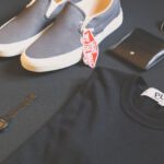 Shoe Brands - Pair of Gray Vans Low-top Sneakers Beside Black Shirt, Sunglasses, and Watch