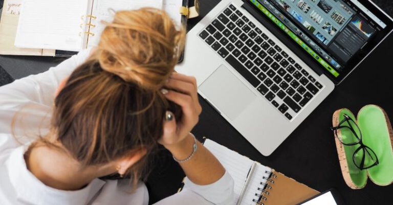 Studying - Woman Sitting in Front of Macbook