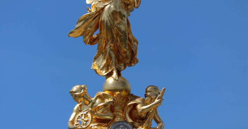 Queen Victoria - Gold Angel Statue Under Blue Sky