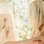 Arts And Humanities - Woman Holding a Brush Painting on a Canvass