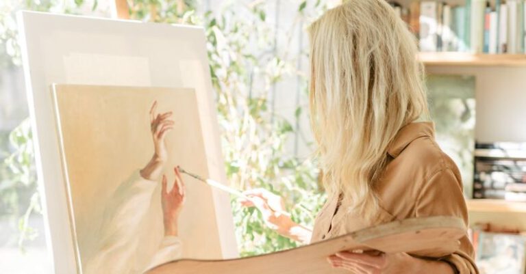 Arts And Humanities - Woman Holding a Brush Painting on a Canvass