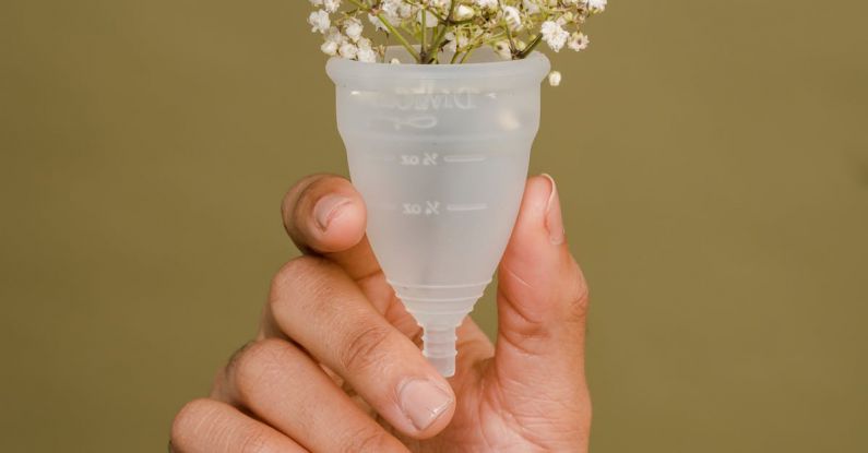 Tudor Period - Faceless woman showing menstrual cup with tender white flowers