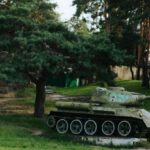 World War II - A tank in a park with trees and grass