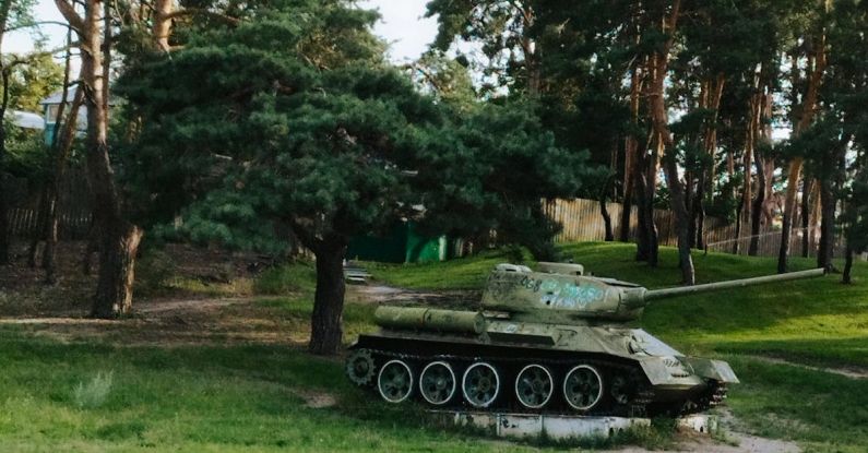 World War II - A tank in a park with trees and grass