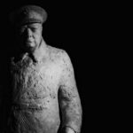 Winston Churchill - Statue of Winston Churchill Standing against a Dark Background