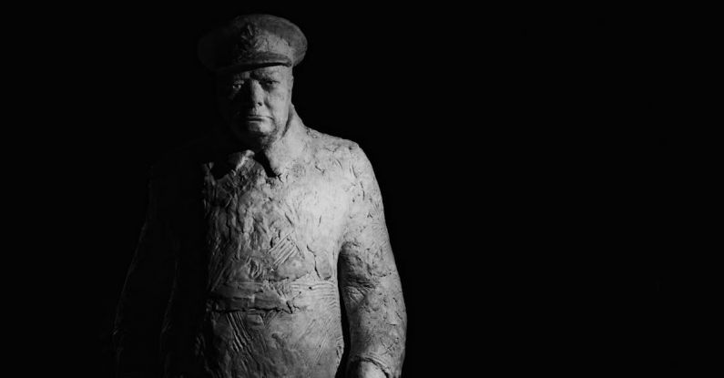 Winston Churchill - Statue of Winston Churchill Standing against a Dark Background