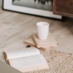 Tea Rooms - Laptop and books on floor carpet