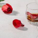 Whisky Tasting - Red rose petals in glass of cognac