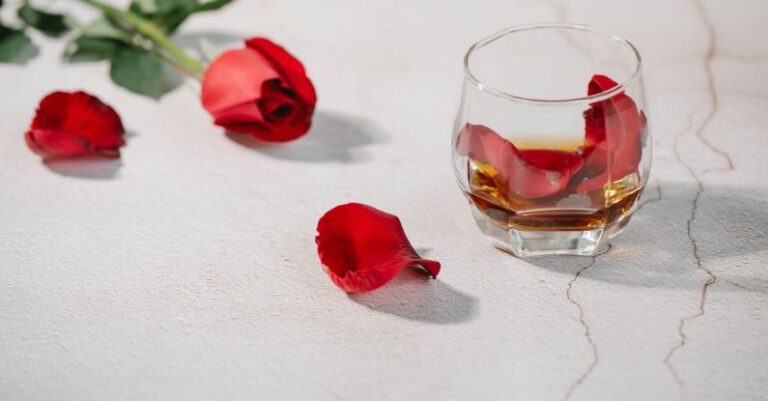 Whisky Tasting - Red rose petals in glass of cognac