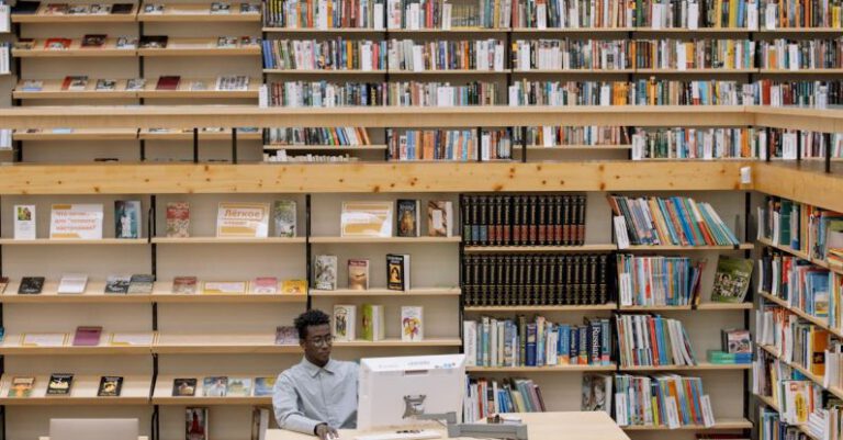 Literary Festivals - Man Using Computer In Library