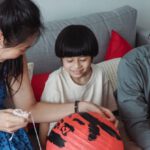 Festival Fringe - Family in a Living Room with Red Lanterns