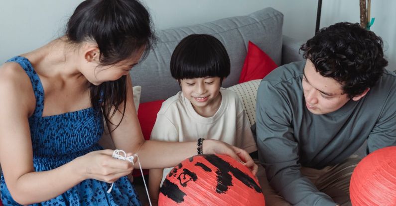 Festival Fringe - Family in a Living Room with Red Lanterns